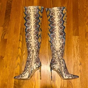 Thigh high snake skin look boots